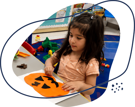 im_class_03 Preschool girl working on a fall paper project